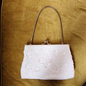 Pearl color vintage inspired purse.